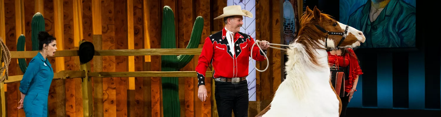 A still from 'Stupid Pet Tricks' featuring Sarah Silverman, a cowboy, and a horse