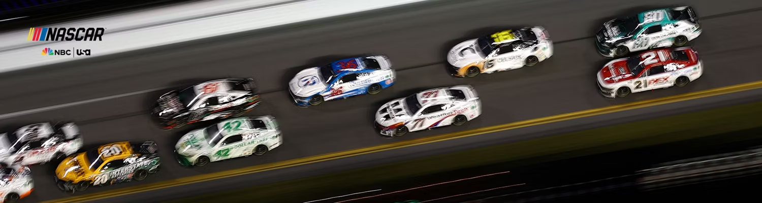 A Group of NASCAR racers rounding a turn