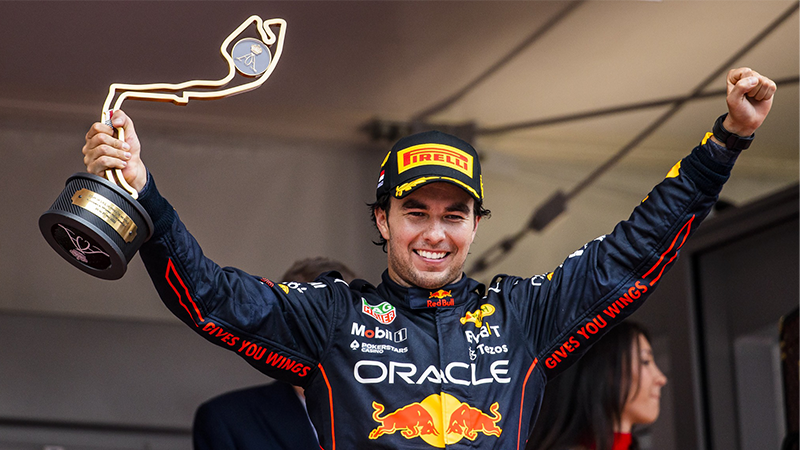 Sergio Pérez holds the trophy after winning the 2022 Monaco Grand Prix.