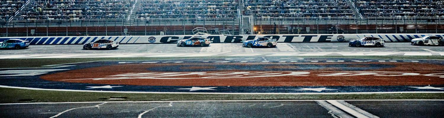 NASCAR racecars on the frontstretch of Charlotte Motor Speedway during the 2022 Coca-Cola 600