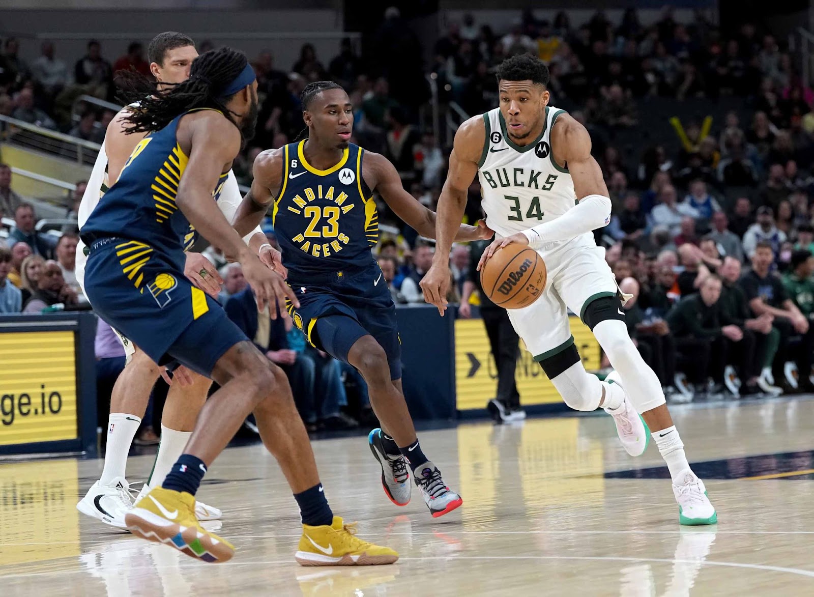 An image of Milwaukee Bucks forward Giannis Antetokounmpo driving the ball against the Indiana Pacers.