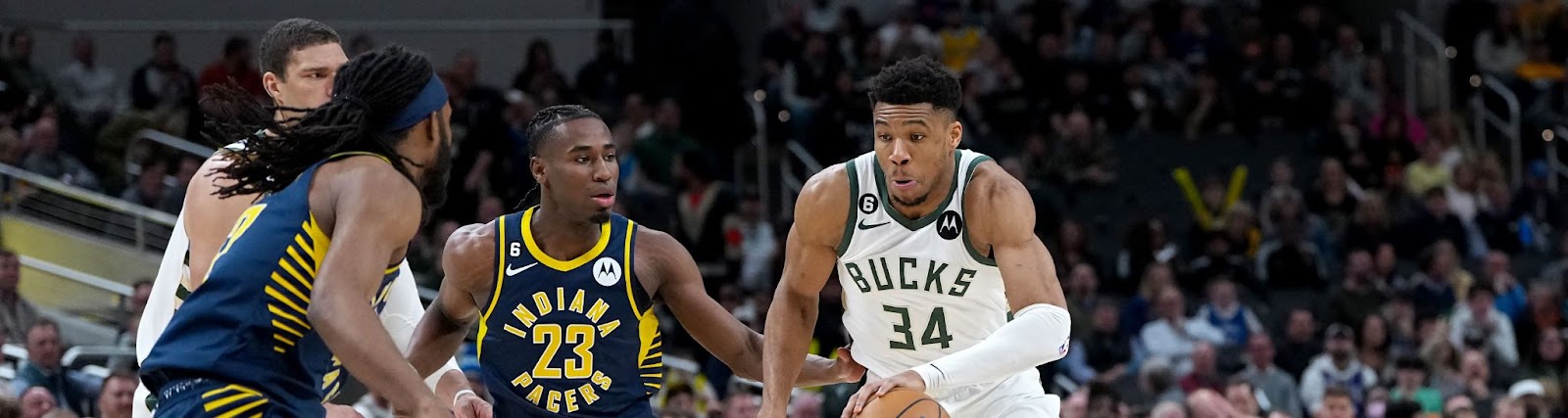 An image of Milwaukee Bucks forward Giannis Antetokounmpo driving the ball against the Indiana Pacers.