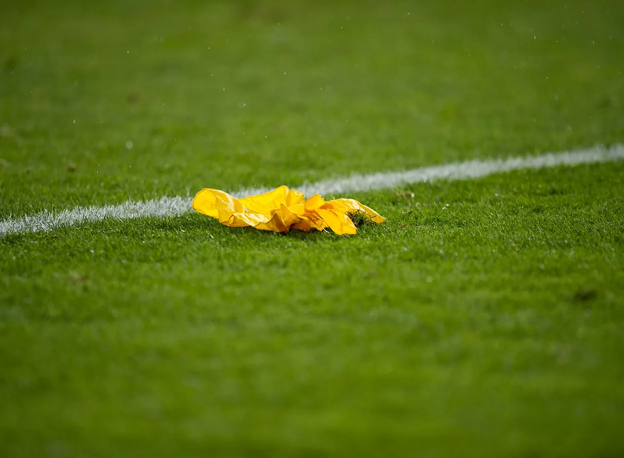 An image of a ref's flag on the football field