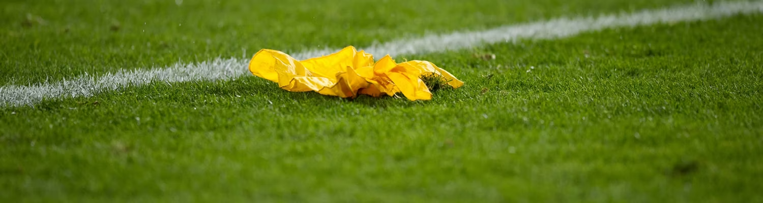 An image of a ref's flag on the football field