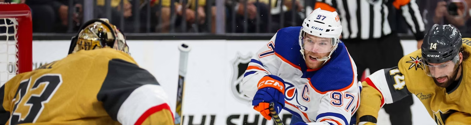 Connor McDavid shooting the puck at the goalie for Vegas